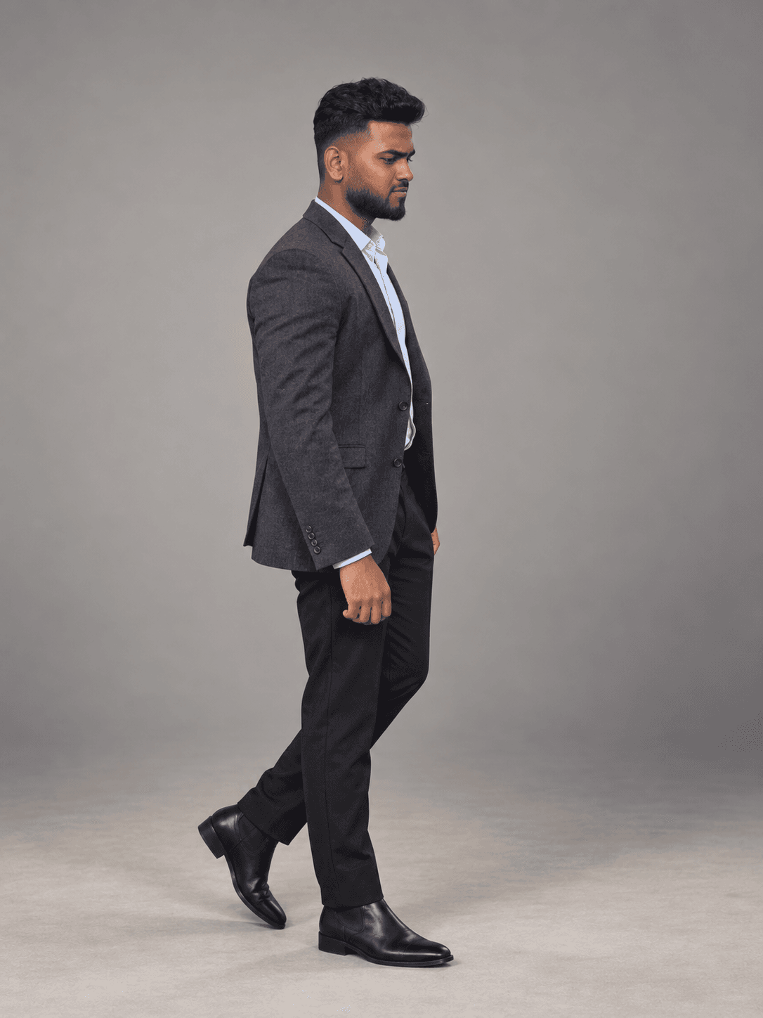 Charcoal tailoring with an open-collar shirt